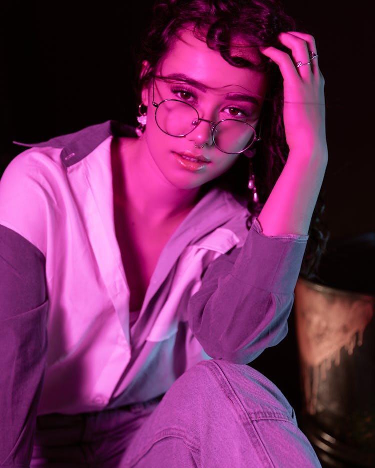 Portrait Of Woman In Glasses Under Neon Lights