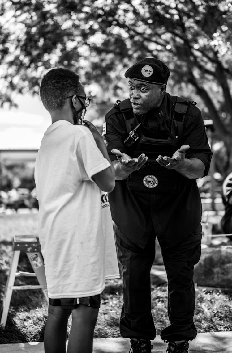 Photo Of A Police Officer Speaking With A Person