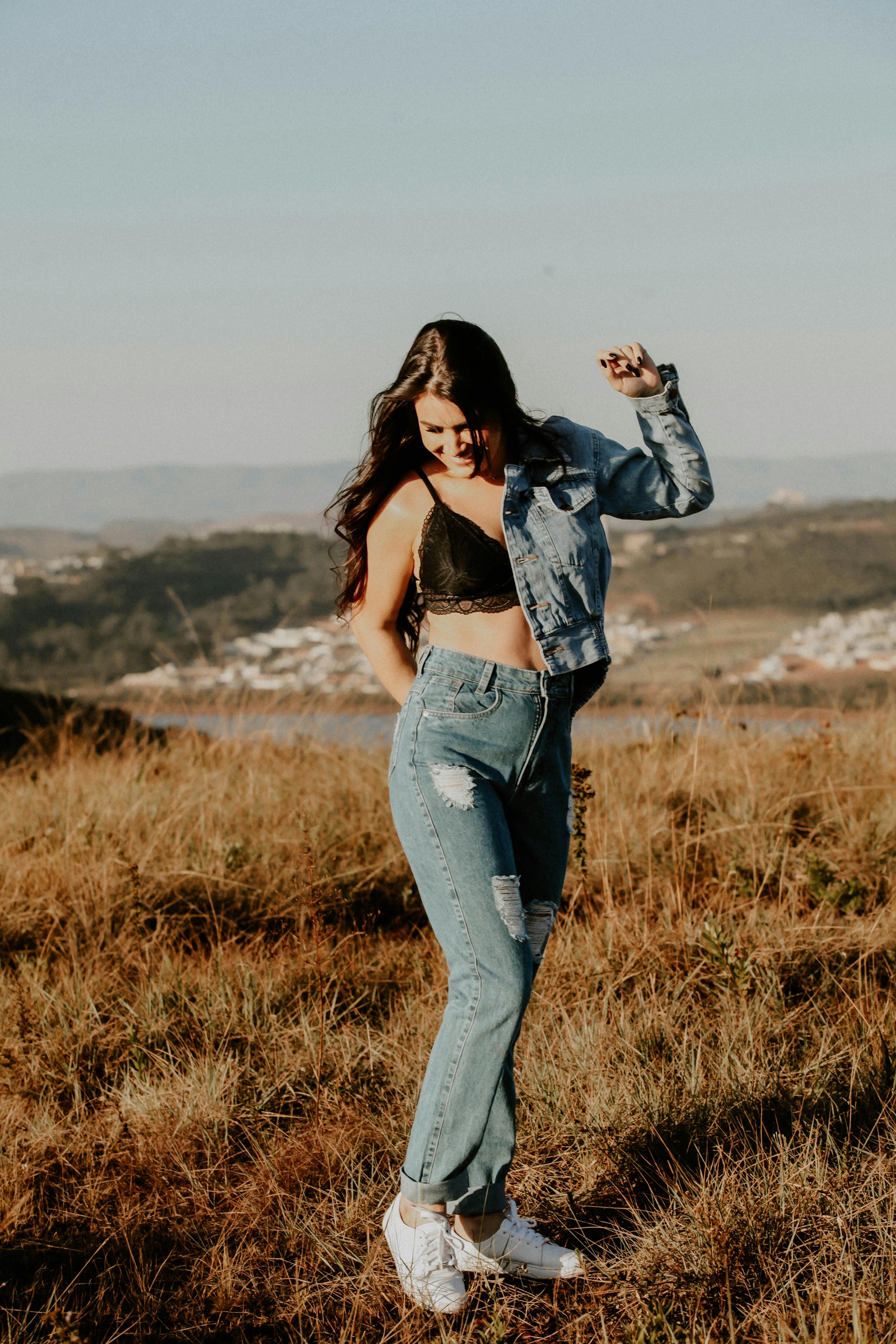 Woman in blue bra and jeans jacket, Stock Photo, Picture And Rights Managed  Image. Pic. ZON-7072575