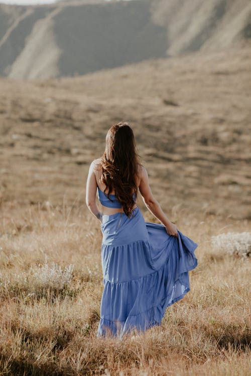 Woman in Blue Dress in Wilderne