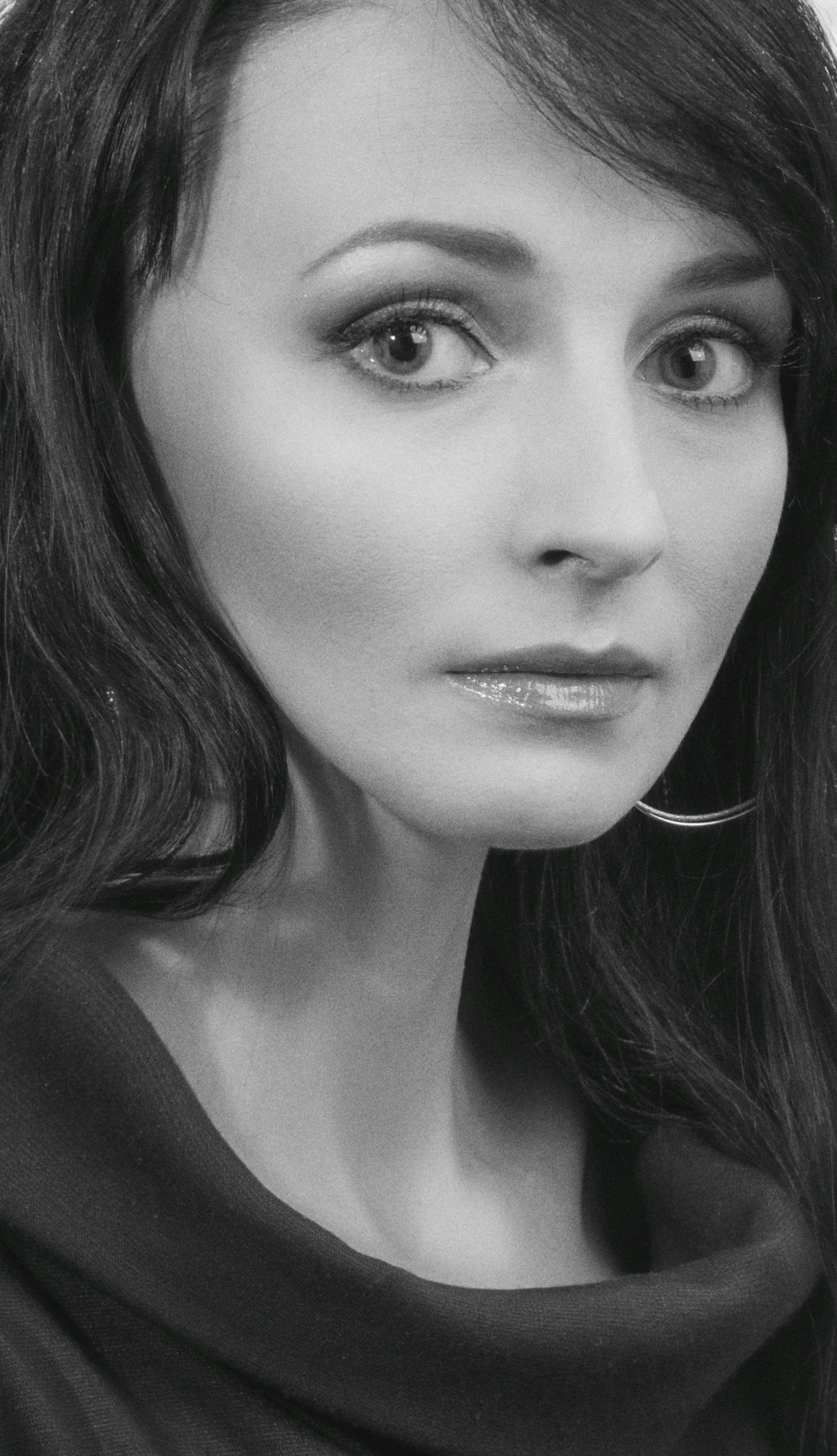 Black and white portrait of a woman with a serious expression in Kyiv.