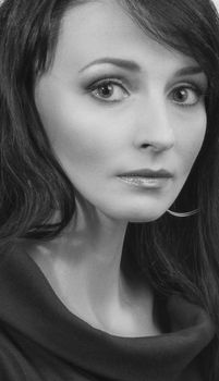 Black and white portrait of a woman with a serious expression in Kyiv.