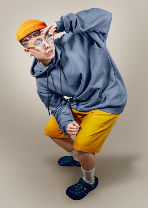 Free Boy in Gray Hoodie and Yellow Shorts Wearing Blue Goggles Stock Photo