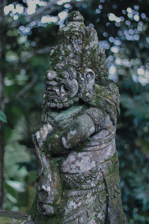 Free Intricate stone carving of a mythological figure in Bali jungle, showcasing Balinese artistry. Stock Photo
