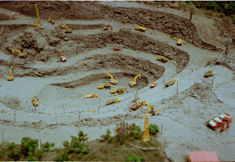 Diorama Of Construction Vehicles Digging In A Quarry