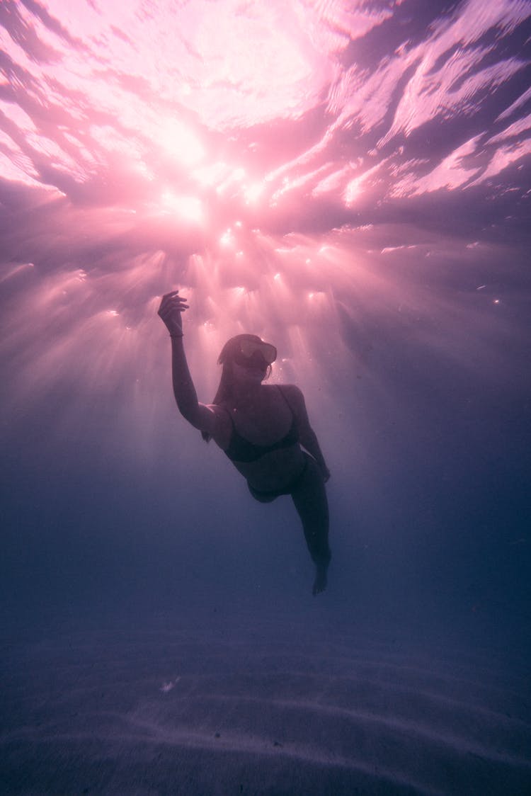 A Woman Swimming Underwater