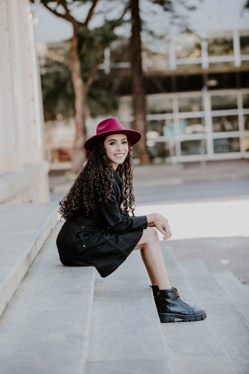 A Woman Sitting on a Step