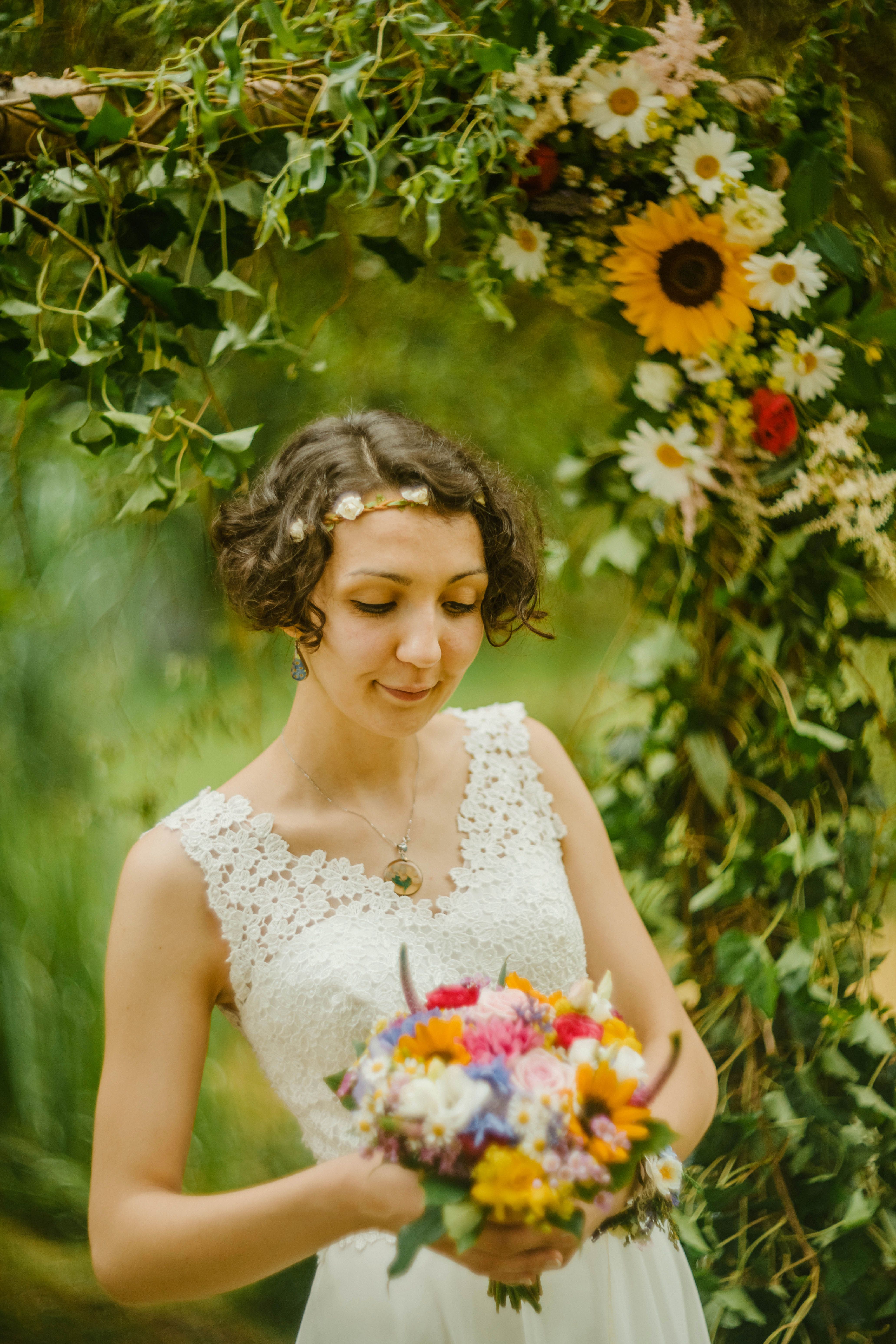 Bride in Wedding Dress Holding Bouquet of Flowers · Free Stock Photo