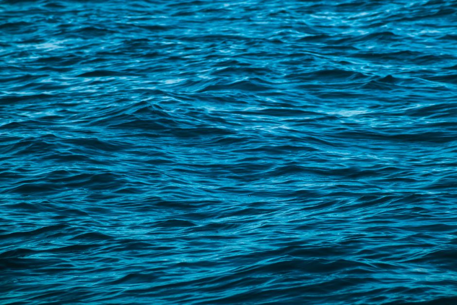 Close-up of the ocean's surface highlighting calm waves and blue water texture
