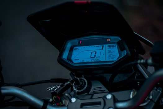 Close-up of a motorcycle digital display showcasing speed and metrics.