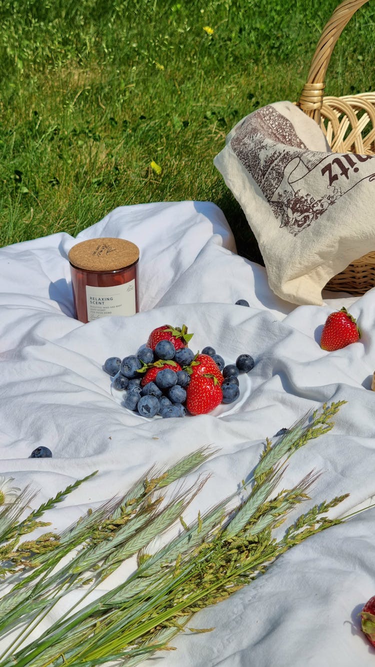 Strawberries And Blueberries On The Picnic Blanket