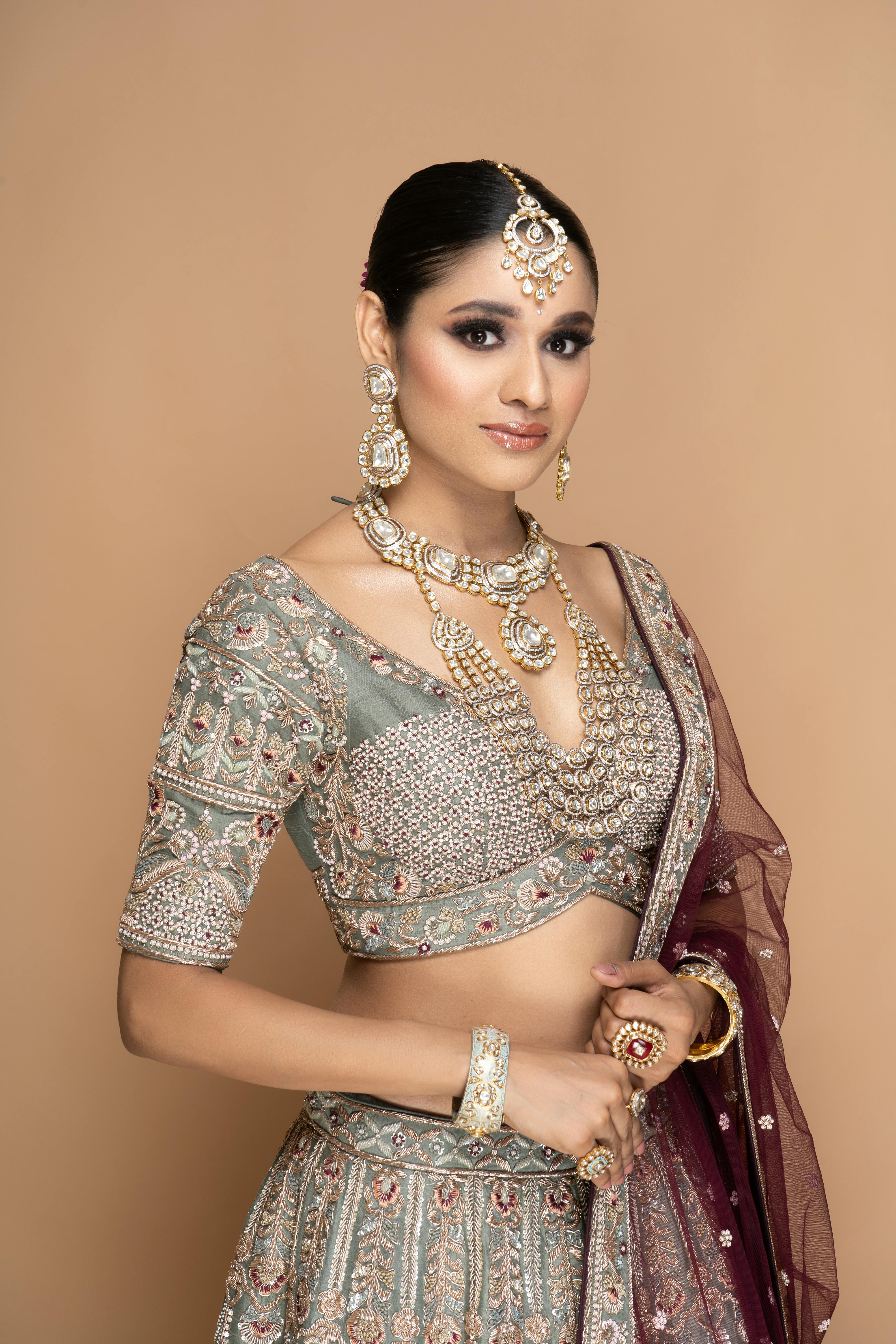 portrait of a pretty brunette wearing an ornate dress