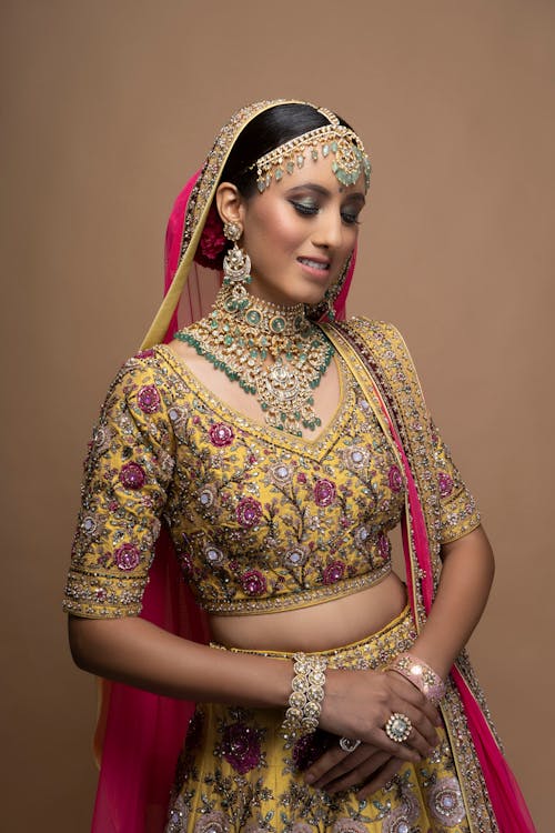 Woman in Yellow and Red Floral Sari