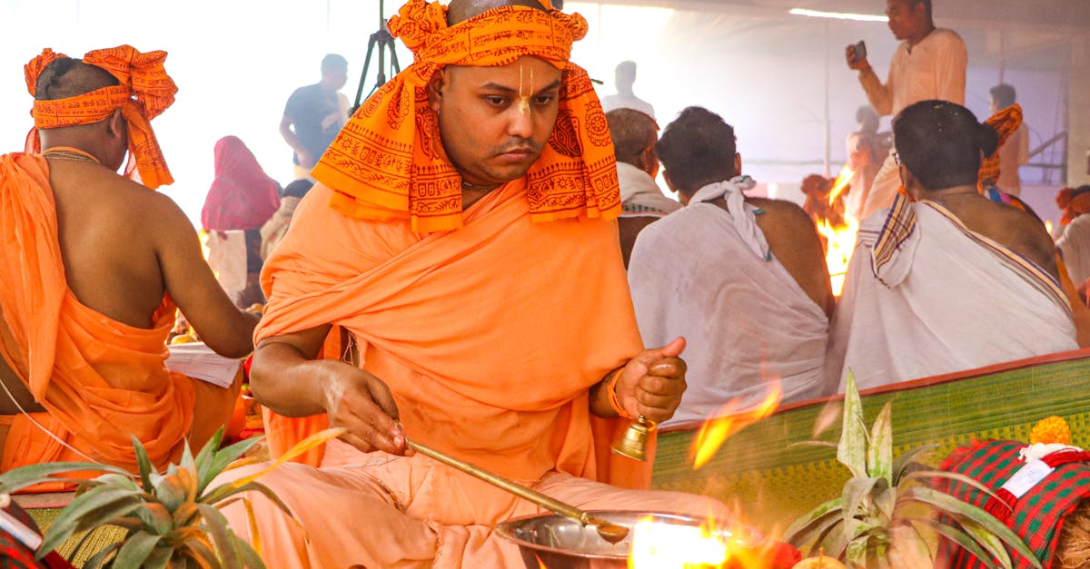 A vibrant Hindu ceremony with monks performing rituals in Dhaka, Bangladesh.
