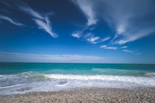 Free Blue Sky over Seashore Stock Photo