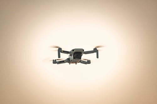 Black and Gray Drone Flying