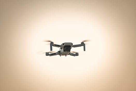 Captivating shot of a drone in flight against a serene sky at dusk, showcasing modern aerial technology.