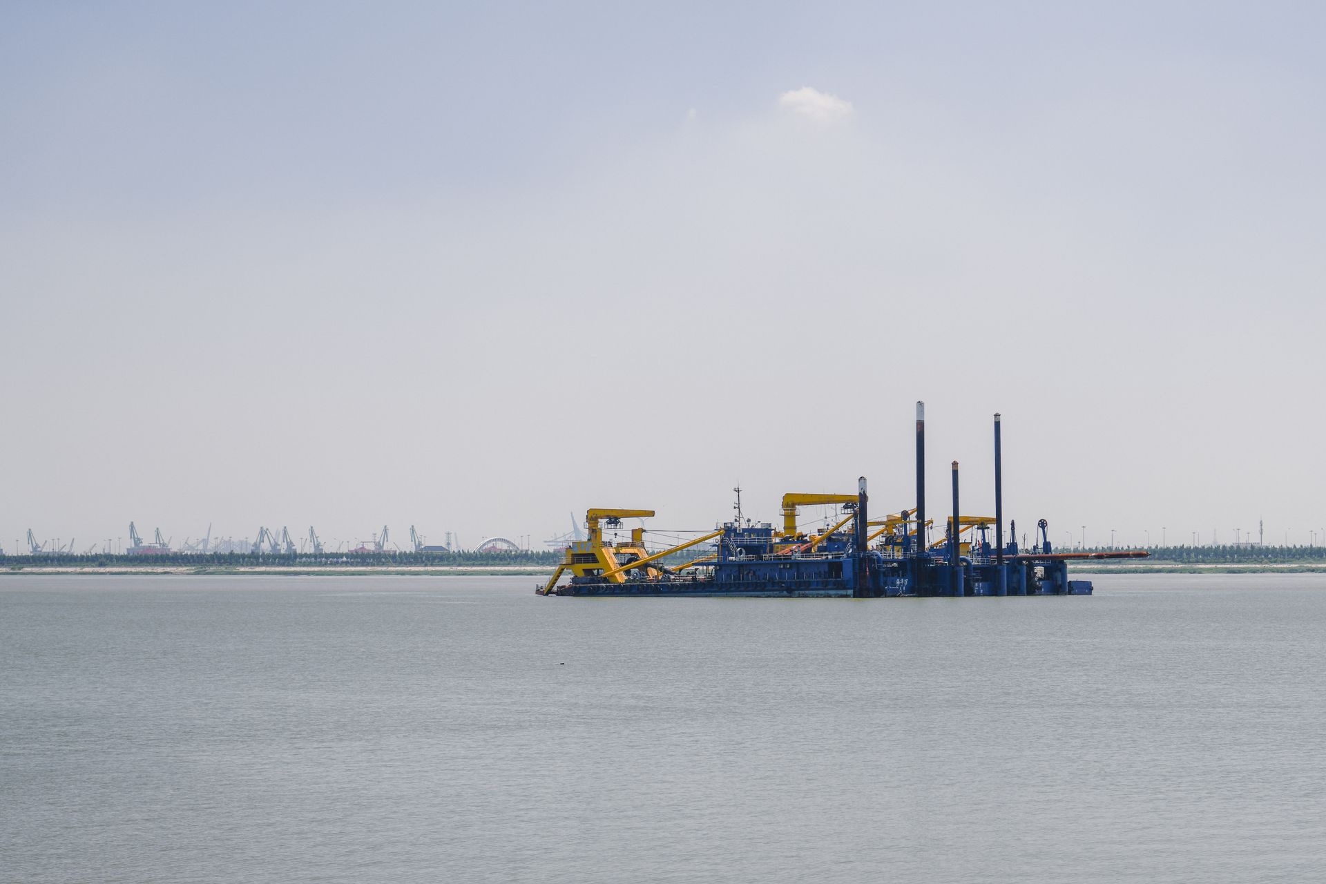 Oil platform in the sea under clear skies, showcasing industrial seascape.
