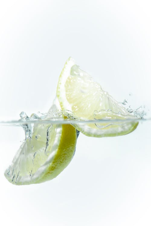Close-up of a Lime Falling into Clear Water 