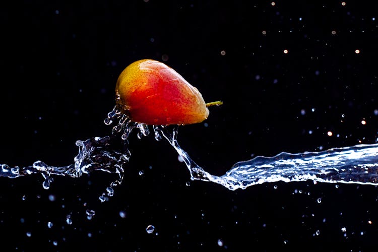 Close-up Of A Pear In Splashing Water 