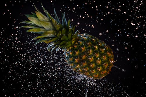 Close-up of a Pineapple in Splashing Water 