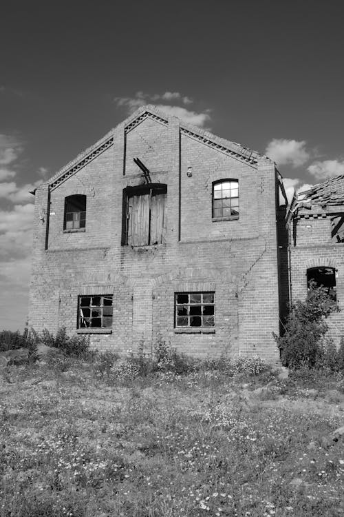 Grayscale Photo of Concrete House