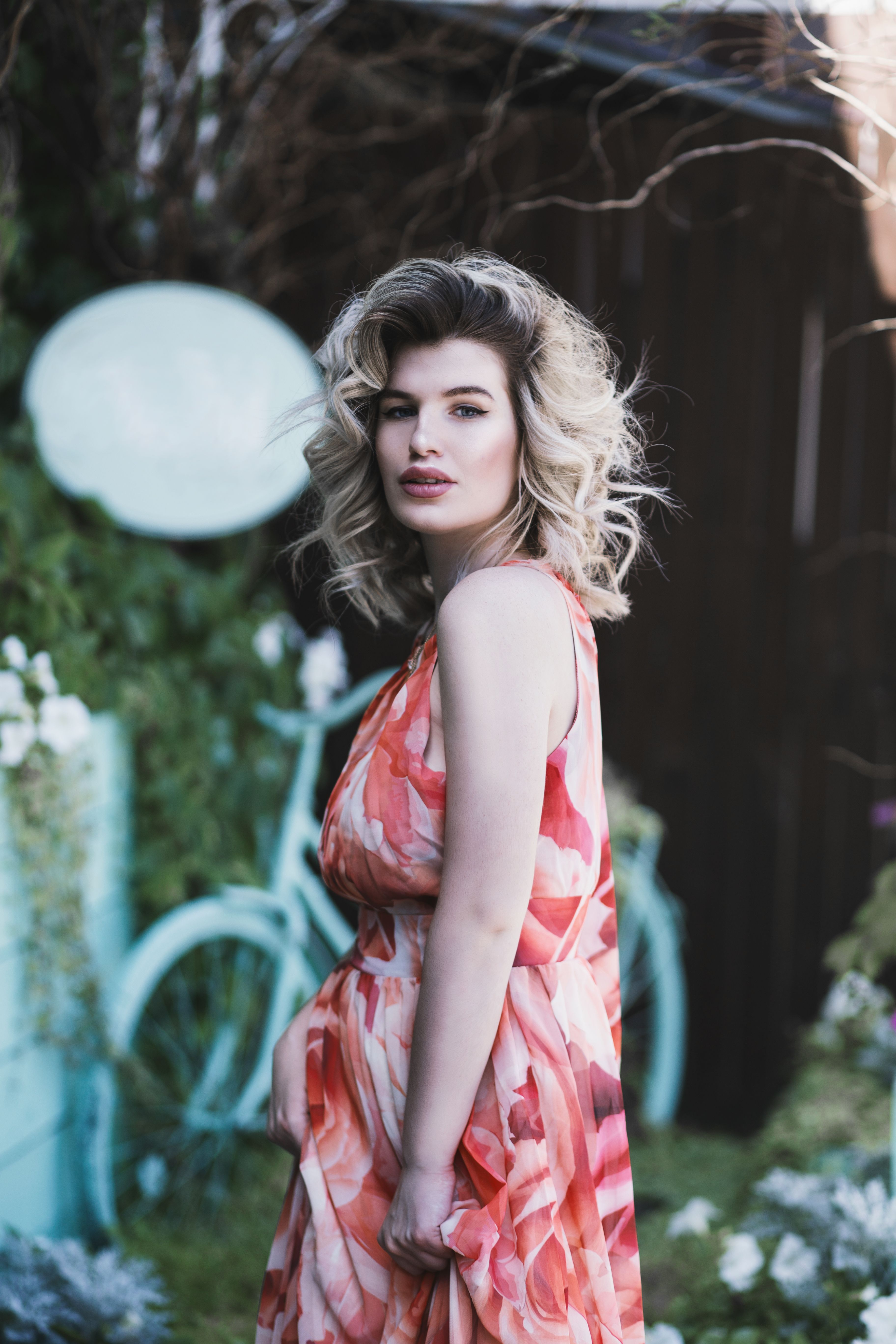 Woman in Floral dress posing for a photograph · Free Stock Photo
