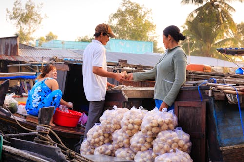 Man Buying on Street Market