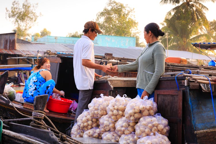 Man Buying On Street Market