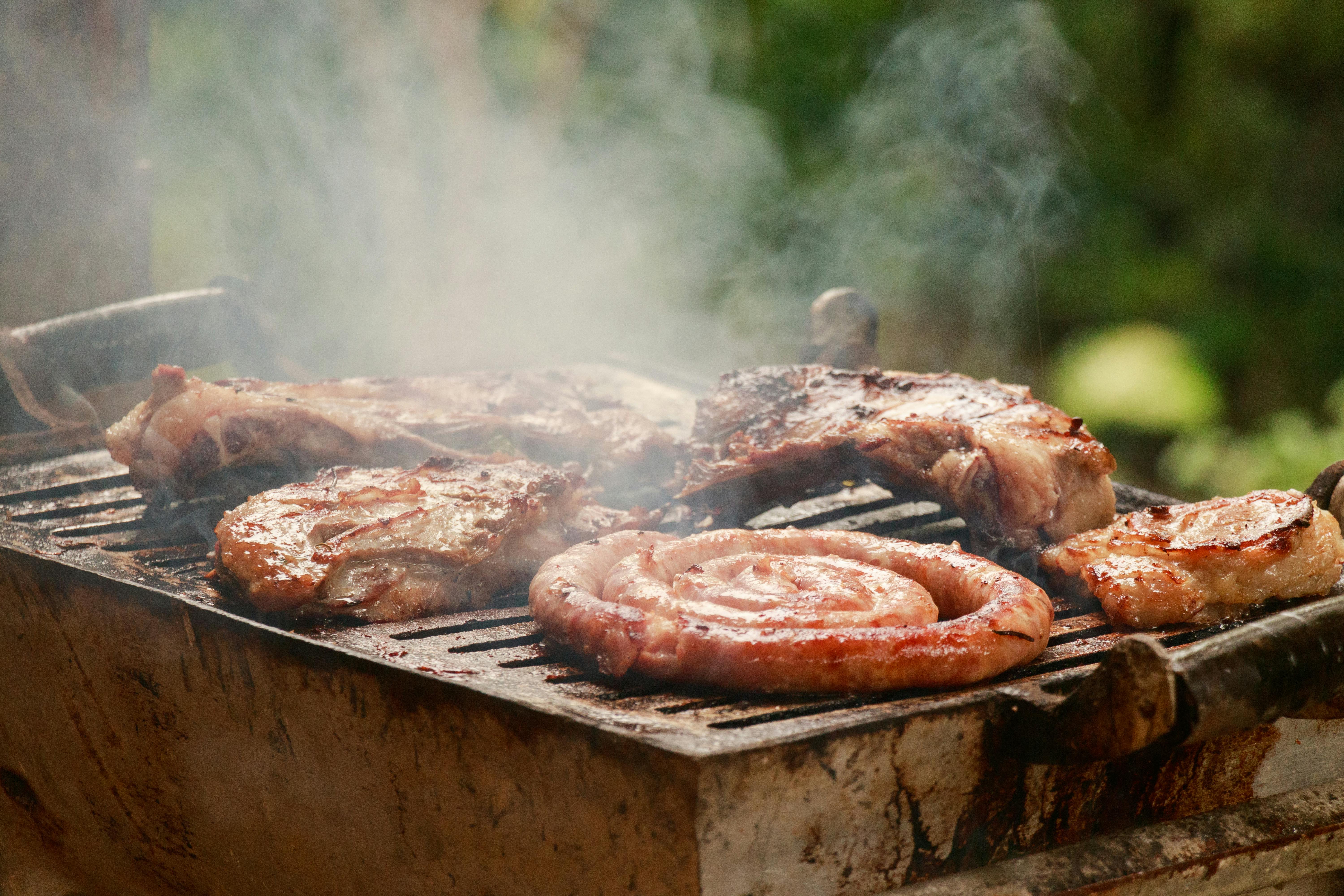 barbecue and sausage on grill