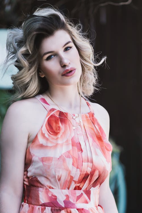 Woman Wearing Pink Floral Spaghetti Tank Top