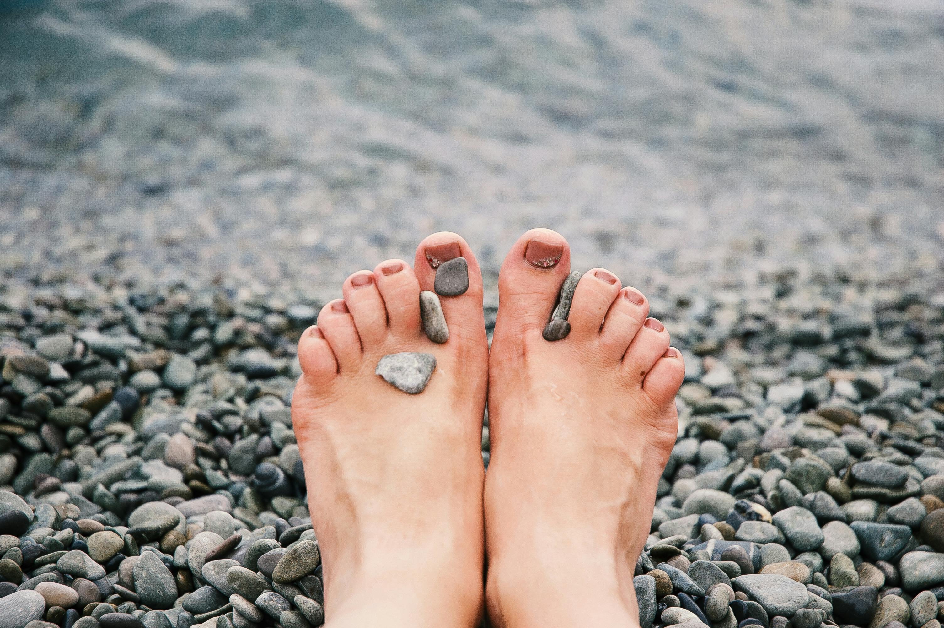Stones on Woman's Feet · Free Stock Photo