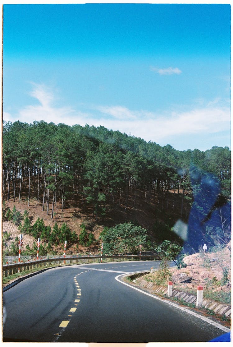 An Empty Road Under The Blue Sky