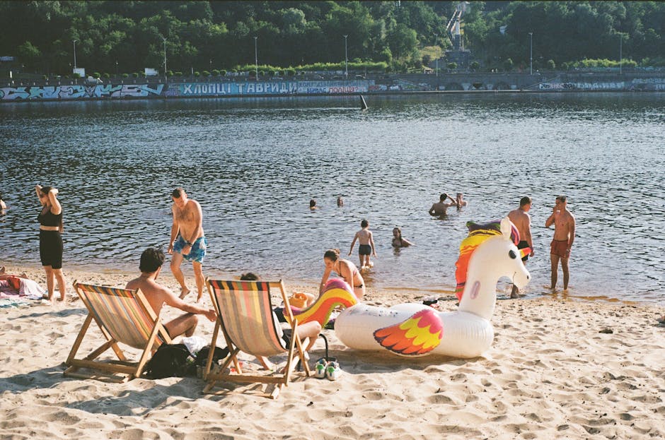 people enjoying the sandy shores of Madison Park Beach - buy a condo in madison park wa people enjoying the sandy shores of Madison Park Beach - buy a condo in madison park wa