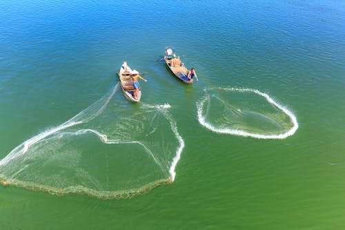 Бесплатное стоковое фото с лодки, море, мужчины