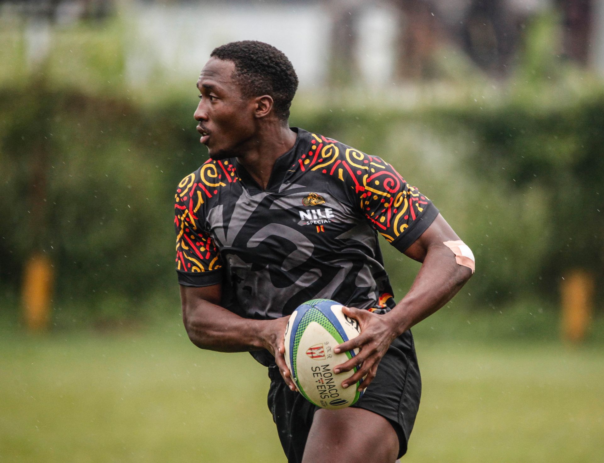 Ayera Desire Holding Rugby Ball while Running