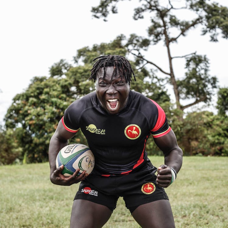 Rugby Player Holding Ball And Shouting