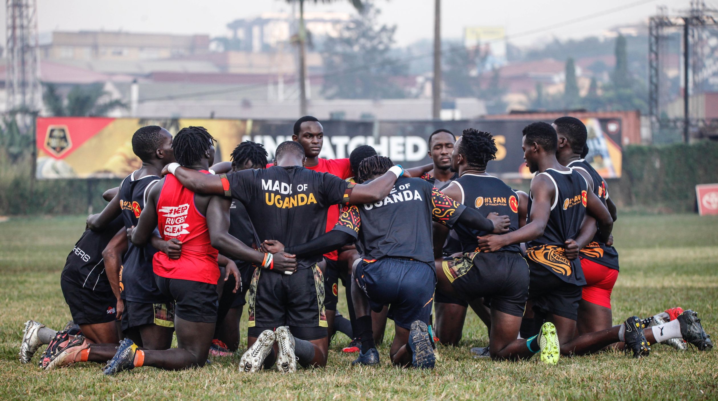 Rugby Team Praying Together on the Field · Free Stock Photo