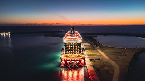 Aerial View of an Illuminated Cruise Ship in a Harbor