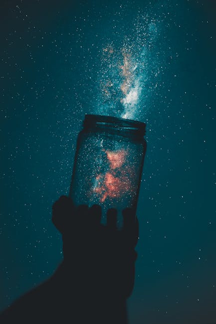 Silhouette of Person Holding Glass Mason Jar