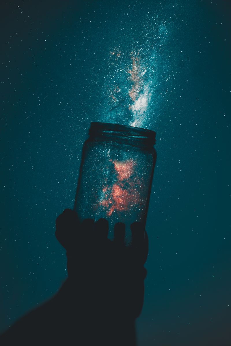 Balanced scales against a starry sky