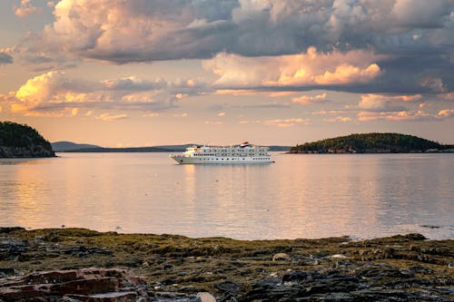 White Cruise Ship  Sailing on Sea Under Cloudy Sky