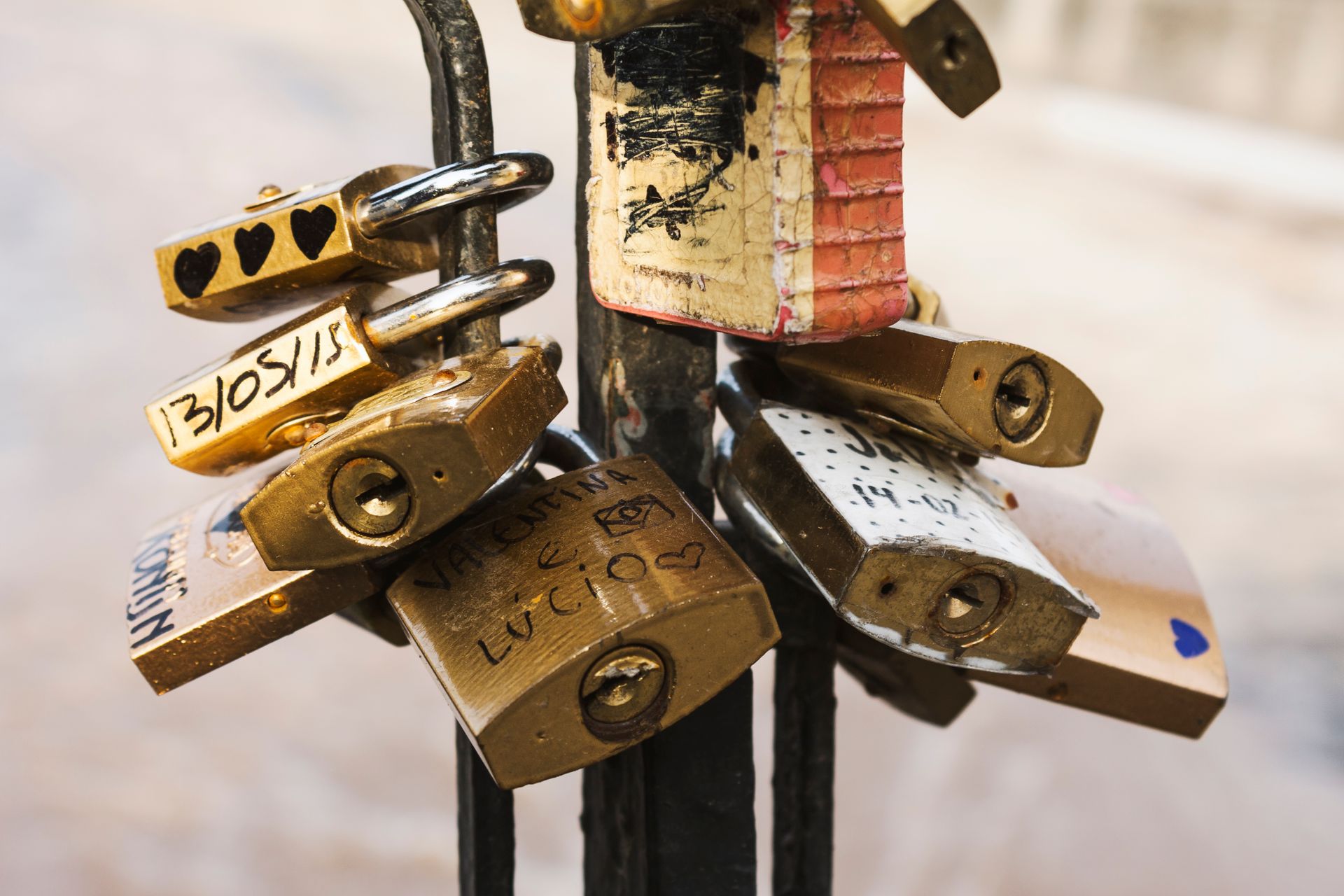 Love padlocks attached to a fence symbolize enduring affection.