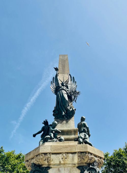 Free A striking view of the Rius and Taulet Monument against a bright blue sky in Barcelona. Stock Photo
