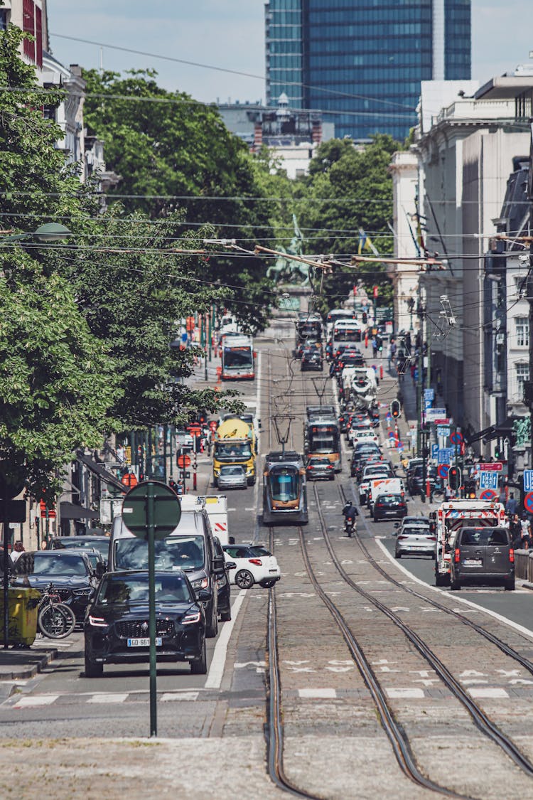 Busy City Street With Trams And Cars 