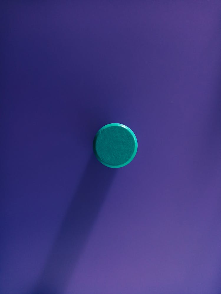 Blue Button On Purple Background 