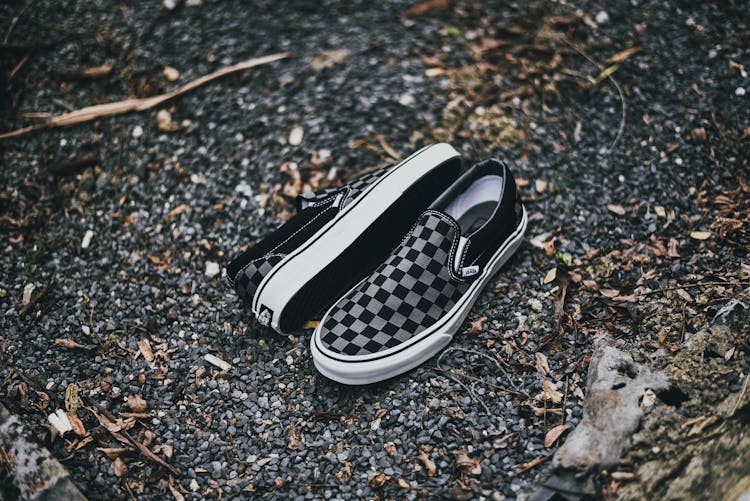 A Pair Of Checkered Shoes On Ground