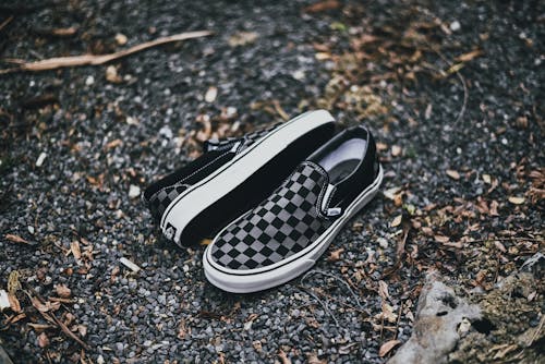 Free Checkered Sneakers on Ground Stock Photo