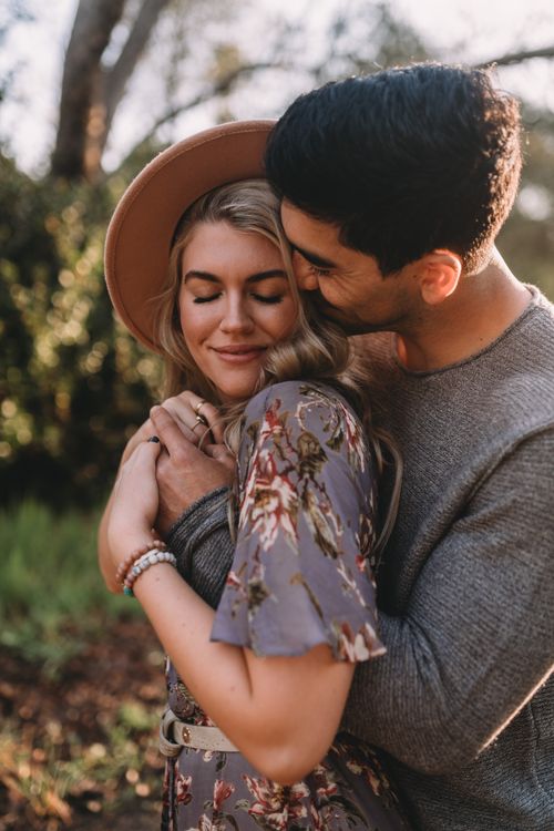 Hugging Sweater A Man in Gray Sweater Hugging His Partner · Free Stock Photo