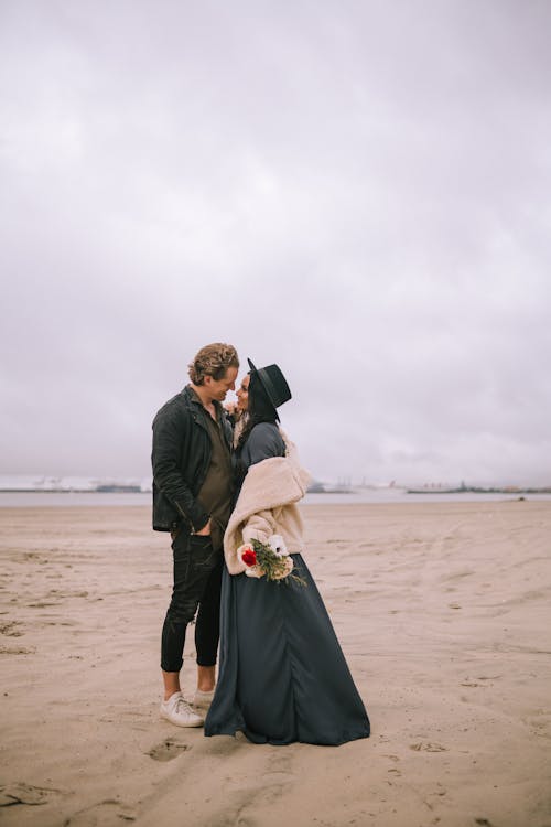 A Couple Standing on the Beach